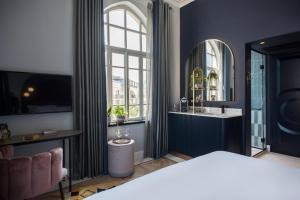 Postel nebo postele na pokoji v ubytování Elmina Hotel Jaffa
