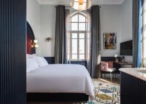 Postel nebo postele na pokoji v ubytování Elmina Hotel Jaffa