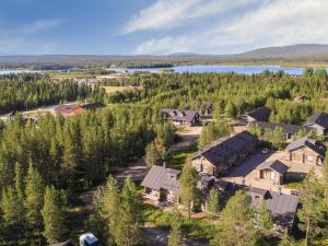 an aerial view of a house with a lake at Holiday Home Kukasrakka a 4 by Interhome in Äkäslompolo