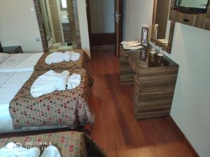 Postel nebo postele na pokoji v ubytování Hotel Bazaar