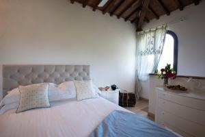A bed or beds in a room at Villa Pianora