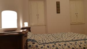Postel nebo postele na pokoji v ubytování The SPIRIT OF LUCCA with all comfortable amenities