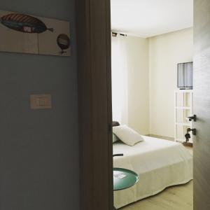 A bed or beds in a room at Villa Joy - Iconic Heritage Rooms