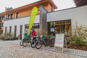 a group of bikes parked in front of a building at Klosterhof – Alpine Hideaway & Spa in Bad Reichenhall