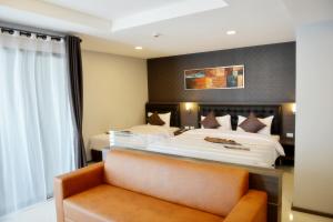 Krevet ili kreveti u jedinici u okviru objekta Picnic Hotel Bangkok - Rang Nam