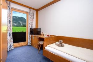 Letto o letti in una camera di Berghof Mitterberg