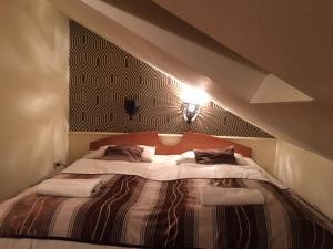 Posteľ alebo postele v izbe v ubytovaní Hotel Minaret&Étterem