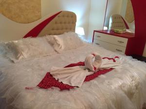 Voodi või voodid majutusasutuse Isra Hotel toas