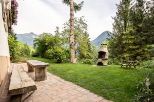 a park with a picnic table and a grill at Ferienhaus Zech in Marul