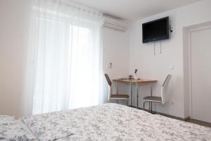 TV a/nebo společenská místnost v ubytování Sobe Meta