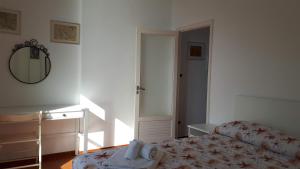 Postel nebo postele na pokoji v ubytování Appartamento Olimpo