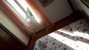 Postel nebo postele na pokoji v ubytování Appartamento Olimpo
