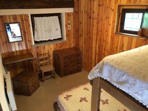 Ένα ή περισσότερα κρεβάτια σε δωμάτιο στο Baita Agostina
