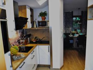 Kuchyň nebo kuchyňský kout v ubytování Ferienwohnung Mondfänger