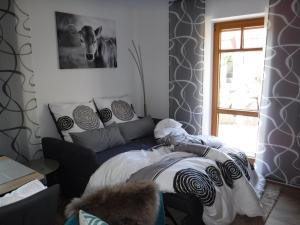 Postel nebo postele na pokoji v ubytování Ferienwohnung Mondfänger