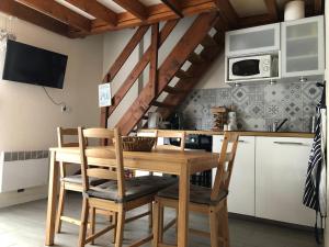 Cuisine ou kitchenette dans l'établissement Cottage à Cabourg