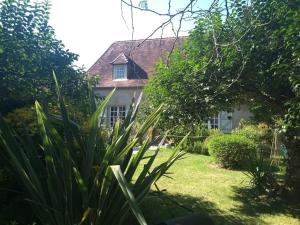 a house with a garden in front of it at Domaine Oustau Cassou Chez Yanou et Yanetto in Sévignac-Thèze +14 photos