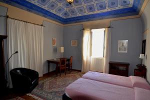 Posteľ alebo postele v izbe v ubytovaní Villa Palagione Centro Interculturale