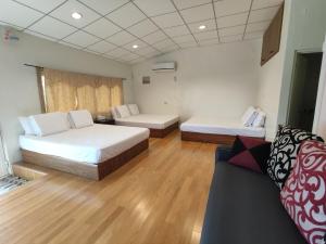 Uma cama ou camas num quarto em Xiao Guilin Homestay