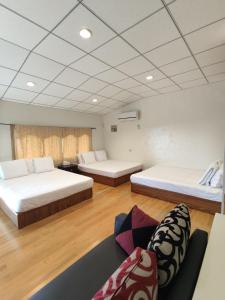 מיטה או מיטות בחדר ב-Xiao Guilin Homestay
