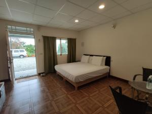 Uma cama ou camas num quarto em Xiao Guilin Homestay