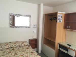 Cama o camas de una habitación en Pensión El Hidalgo
