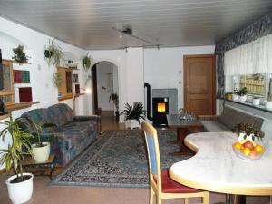 a living room with a couch and a table at Haus Cornelia in Mallnitz