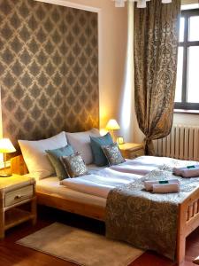 Łóżko lub łóżka w pokoju w obiekcie Baron Boutique Hotel