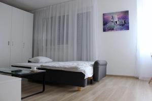 Postel nebo postele na pokoji v ubytování Little Romance in Bratislava