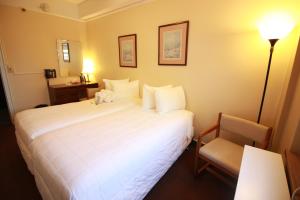 A bed or beds in a room at Leo House