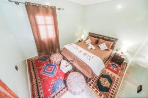 Postel nebo postele na pokoji v ubytování Dar Widad
