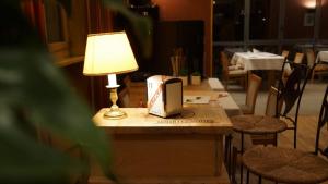 Restaurace v ubytování Hôtel de charme L'Orée du Parc
