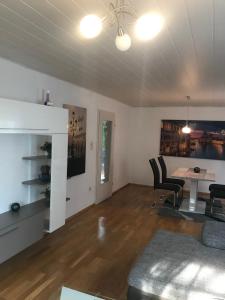 an empty living room with a table and chairs at Obere Kellerstraße Haus 3 in Forchheim