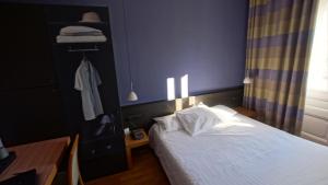 Postel nebo postele na pokoji v ubytování Hôtel de charme L'Orée du Parc