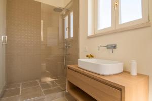 a bathroom with a sink and a shower at Palazzo Mulini in Monopoli