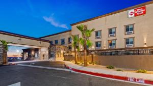 an image of a hotel with a parking lot at Best Western Plus New Barstow Inn & Suites in Barstow