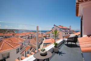 a balcony with a view of the city at Reserva FLH Hotels Ericeira in Ericeira