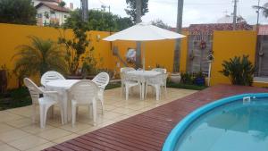 Der Swimmingpool an oder in der Nähe von Casa Pousada Rosa dos Ventos