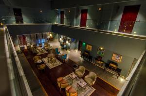 an overhead view of a hotel lobby with tables and chairs at Phoenicia Boutique Hotel - Adults Only in Mamaia Nord +89 photos