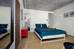 Llit o llits en una habitació de Tulum Apart Belgrade