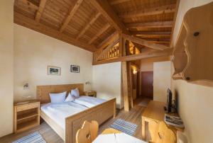 Krevet ili kreveti u jedinici u okviru objekta Hotel Gasthof Stuibenfall