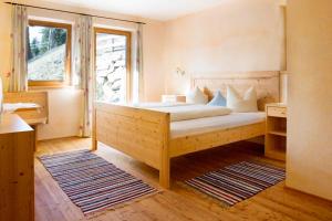 Krevet ili kreveti u jedinici u okviru objekta Hotel Gasthof Stuibenfall