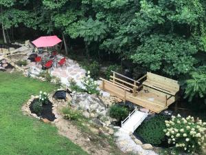 an overhead view of a garden with a bench and a table at Lamp Lighter Mountain Inn in Zirconia