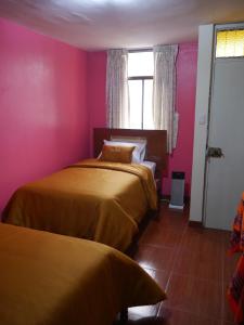 Llit o llits en una habitació de RUNAWASI Peruvian Home