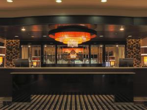 a lobby of a hotel with a large chandelier at APA Hotel Yamagata Tsuruoka Ekimae in Tsuruoka