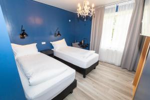 Krevet ili kreveti u jedinici u okviru objekta Hotel North