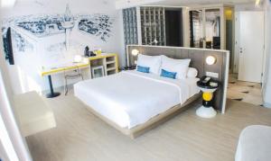 Letto o letti in una camera di YELLO Hotel Harmoni