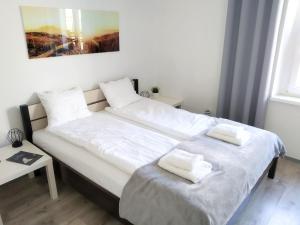 Ein Bett oder Betten in einem Zimmer der Unterkunft Zacisze Starówki
