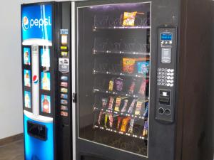 a vending machine filled with lots of food and drinks at Economy 7 Inn in Norfolk