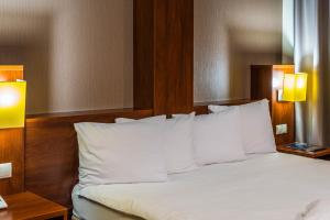
Łóżko lub łóżka w pokoju w obiekcie Hotel Na Półboru
